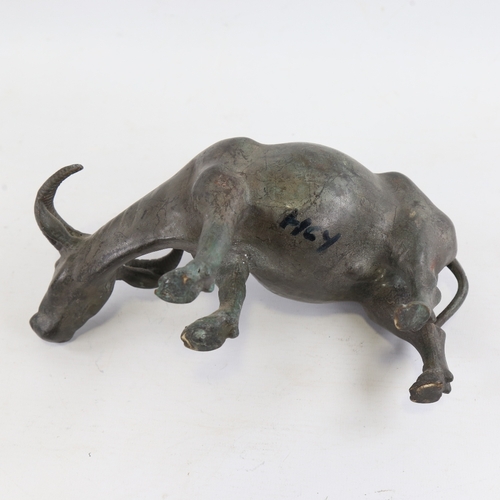 152 - A Chinese patinated bronze water buffalo, length 23cm, height 13cm