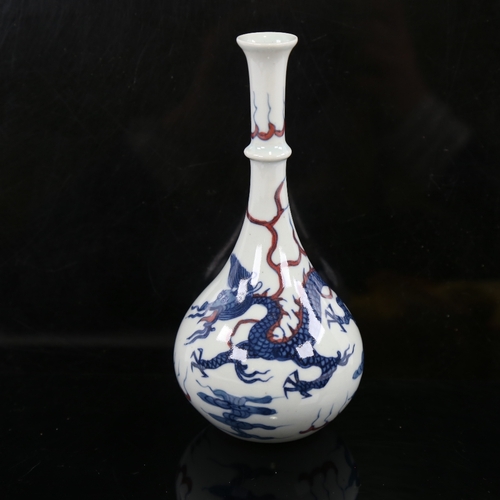 156 - A small Chinese white glaze porcelain bottle vase, hand painted blue and iron red dragon and pearl d... 