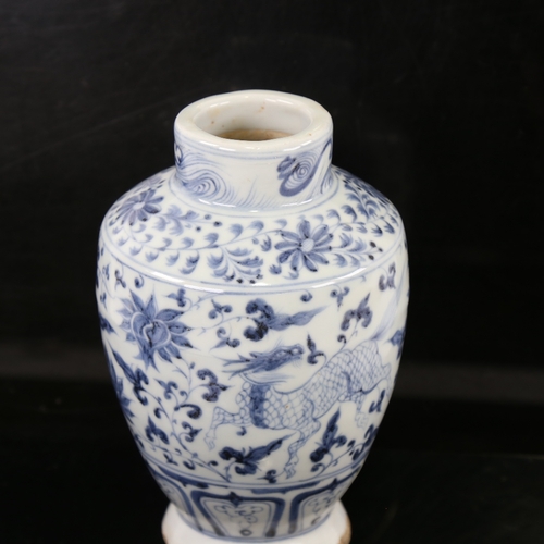 159 - A Chinese blue and white porcelain Yuan style vase, hand painted beasts, height 18cm