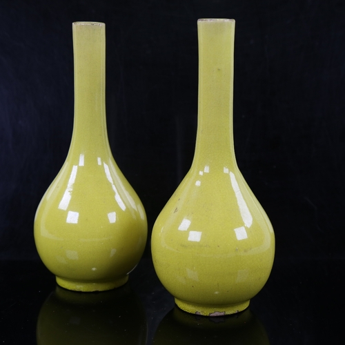 161 - A small pair of Chinese yellow glaze porcelain narrow-neck bottle vases, height 15cm