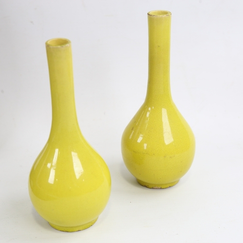 161 - A small pair of Chinese yellow glaze porcelain narrow-neck bottle vases, height 15cm