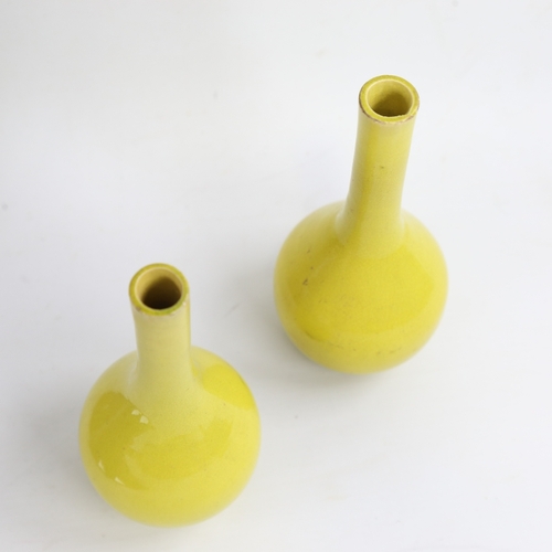 161 - A small pair of Chinese yellow glaze porcelain narrow-neck bottle vases, height 15cm