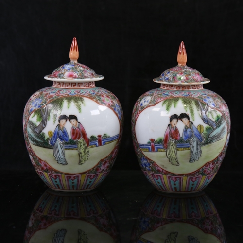 162 - A pair of small Chinese porcelain jars and covers, hand painted scenes with figures in gardens, 6 ch... 