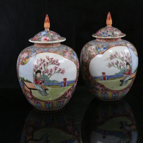 162 - A pair of small Chinese porcelain jars and covers, hand painted scenes with figures in gardens, 6 ch... 