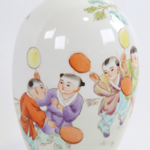 167 - A Chinese porcelain vase with painted study of children playing in gardens, 4 character mark, height... 