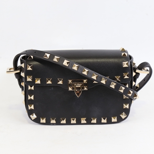 171 - VALENTINO - a small black leather and steel studded handbag with strap, length 15.5cm, with dustbag