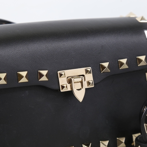 171 - VALENTINO - a small black leather and steel studded handbag with strap, length 15.5cm, with dustbag