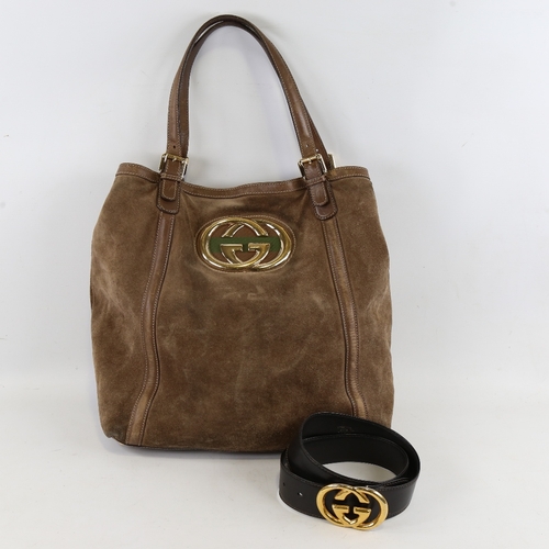 173 - GUCCI - a brown suede and leather shoulder bag with gilt monogram badge, length approx 40cm, height ... 