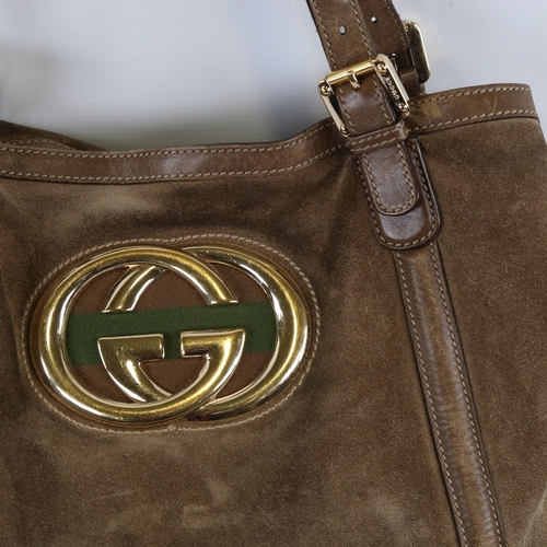 173 - GUCCI - a brown suede and leather shoulder bag with gilt monogram badge, length approx 40cm, height ... 