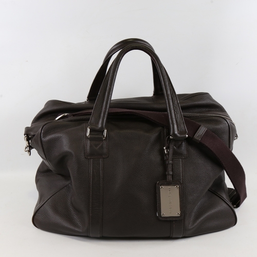 175 - DOLCE & GABBANA - a dark brown leather holdall with shoulder strap, length approx 48cm