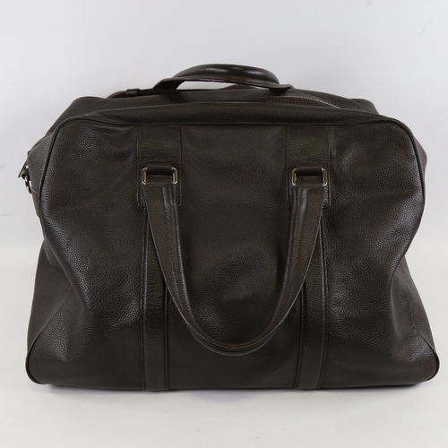 175 - DOLCE & GABBANA - a dark brown leather holdall with shoulder strap, length approx 48cm