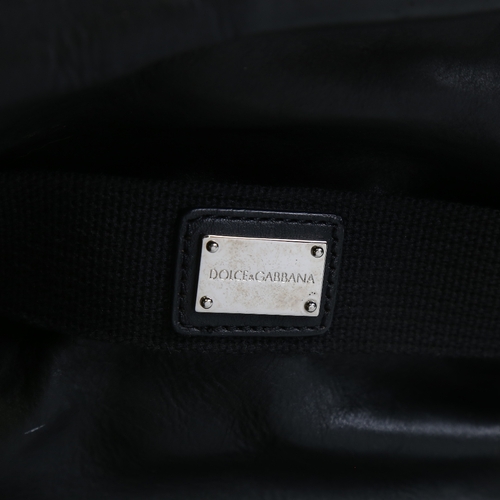 176 - DOLCE & GABBANA - a black leather holdall with shoulder strap, length approx 60cm