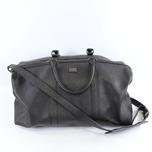 177 - DOLCE & GABBANA - a black leather holdall with shoulder strap, length approx 50cm