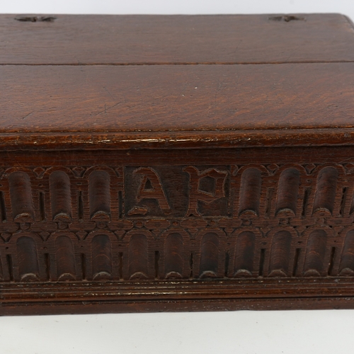 86 - An 18th century oak Bible box, with Arcadian carved front panel and initials AP, 45cm x 30cm x 19cm