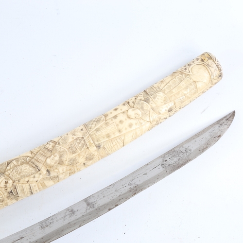 91 - A Japanese bone short sword, Meiji Period late 19th/early 20th century, relief carved figures all ov... 