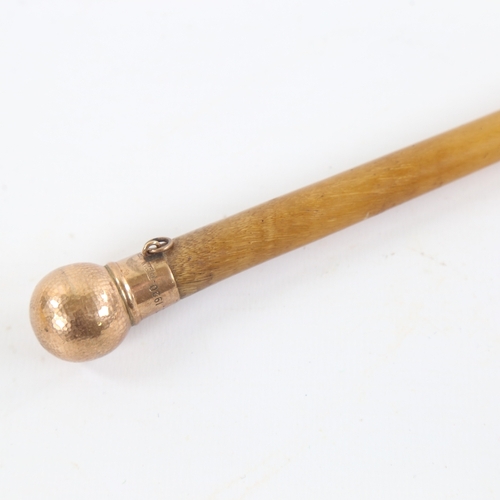 96 - A rhino horn riding crop with 9ct gold planished top, inscribed EC Olympia 1920, by Swaine & Adeney,... 