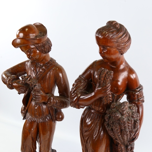 98 - A pair of 19th century carved and stained wood standing harvest figures, height 48cm