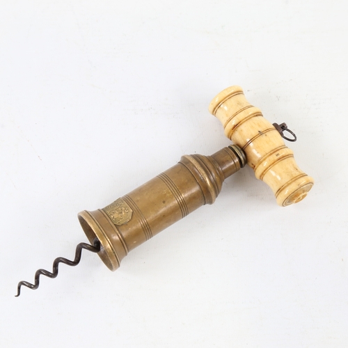 425 - A Victorian patent brass and ivory-handled corkscrew