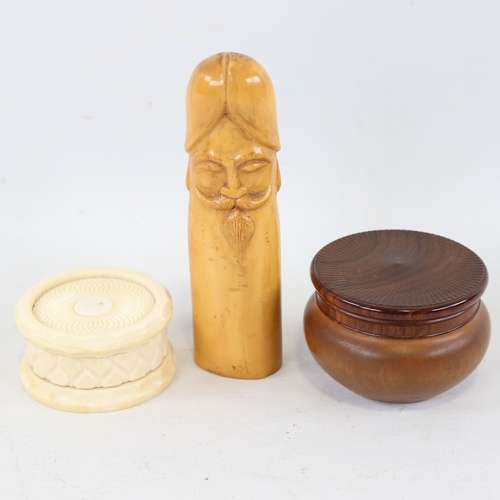 428 - A Victorian circular carved ivory box, 6cm across, a carved olivewood circular box, and a compositio... 