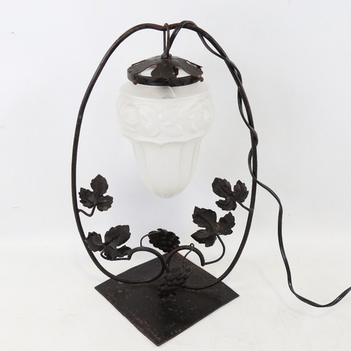 433 - French Art Nouveau hand forged iron lamp, circa 1920, decorated with vine leaves and grapes and orig... 