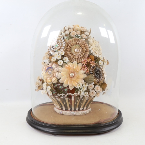 435 - A 19th century floral shell display under glass dome, overall height 42cm