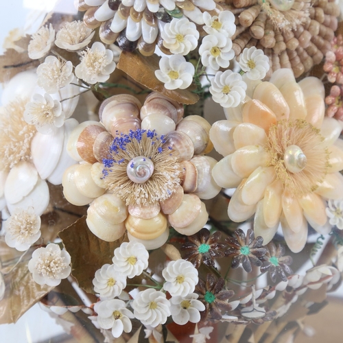 435 - A 19th century floral shell display under glass dome, overall height 42cm