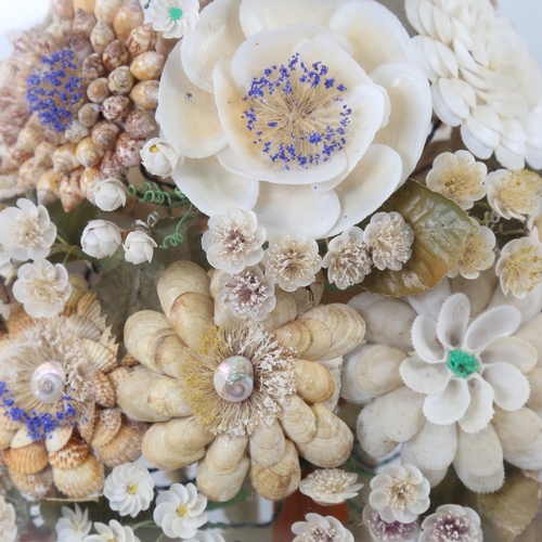 435 - A 19th century floral shell display under glass dome, overall height 42cm