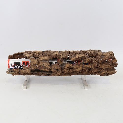 2202 - Chris Watson, graffitied tube train in log, mixed media wood/metal/paint, length 14