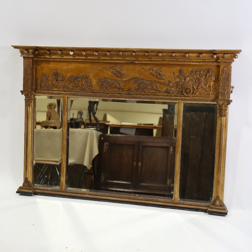 183 - An early 19th century gilt-gesso framed triple-glass over mantel mirror, with ball pediment, relief ... 