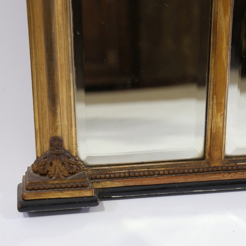 183 - An early 19th century gilt-gesso framed triple-glass over mantel mirror, with ball pediment, relief ... 