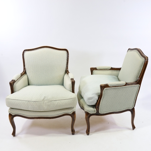 185 - A pair of Louis XVI style walnut-framed upholstered salon chairs, modern