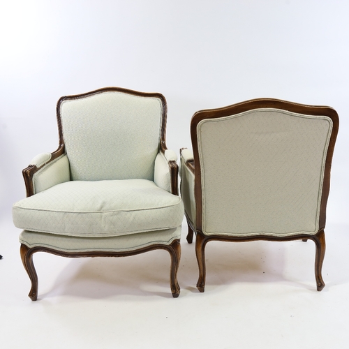 185 - A pair of Louis XVI style walnut-framed upholstered salon chairs, modern