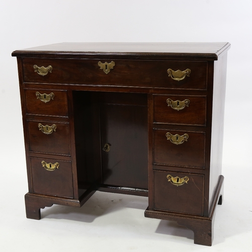 186 - A George III mahogany kneehole writing desk of small size, with alcove cupboard and drawers, 81cm x ... 