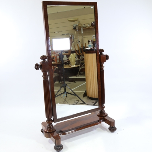 23 - A Victorian mahogany-framed cheval mirror, with melon carved finials, reeded supports and stretcher ... 