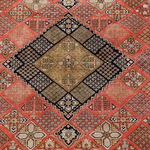 444 - An Iranian red and yellow ground silk rug, 210cm x 138cm