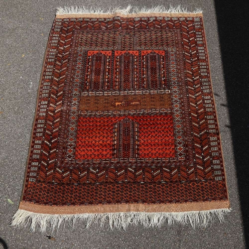 445 - An Antique Iranian hand-woven wool rug, lion and geometric decoration, 174cm x 140cm