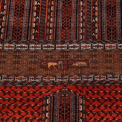 445 - An Antique Iranian hand-woven wool rug, lion and geometric decoration, 174cm x 140cm