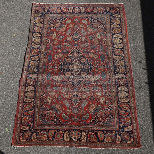 446 - An intricate antique red ground Persian rug, 200 x 135cm.