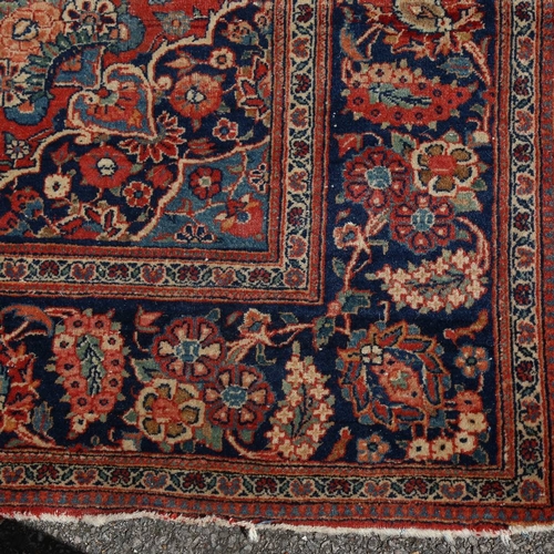 446 - An intricate antique red ground Persian rug, 200 x 135cm.