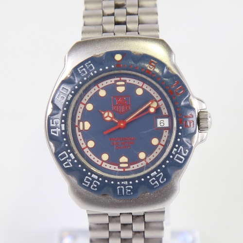 1009 - TAG HEUER - a stainless steel Formula 1 Professional 200M quartz wristwatch, ref. WA1210, blue dial ... 