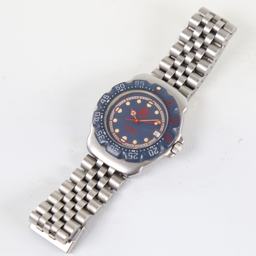 1009 - TAG HEUER - a stainless steel Formula 1 Professional 200M quartz wristwatch, ref. WA1210, blue dial ... 