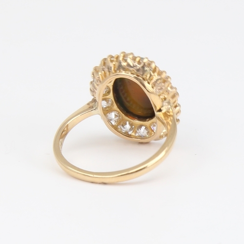 1101 - An early 20th century 18ct gold black opal and diamond cluster ring, set with oval high cabochon bla... 