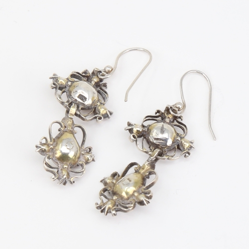 1103 - A pair of Dutch Georgian unmarked silver pearl and flat-top garnet pendant earrings, openwork scroll... 