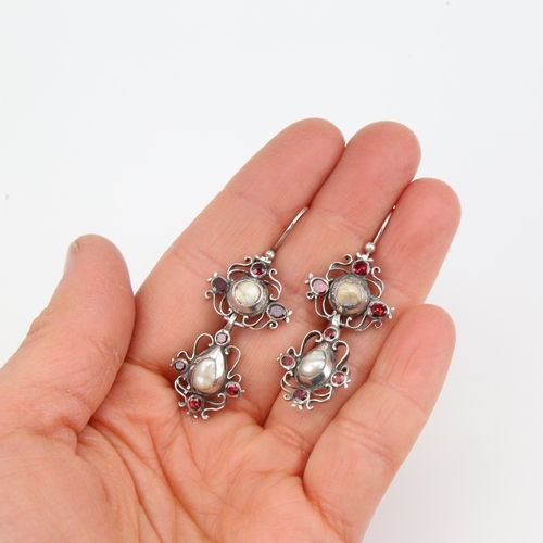 1103 - A pair of Dutch Georgian unmarked silver pearl and flat-top garnet pendant earrings, openwork scroll... 