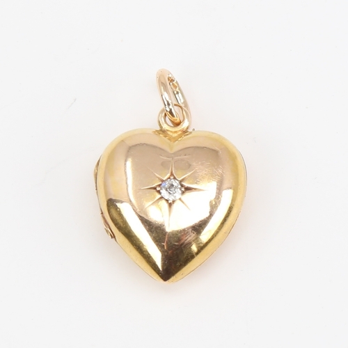 1106 - A Victorian 18ct gold diamond set heart locket pendant, set with old-cut diamond and 15ct bale, heig... 