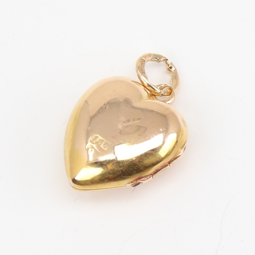 1106 - A Victorian 18ct gold diamond set heart locket pendant, set with old-cut diamond and 15ct bale, heig... 