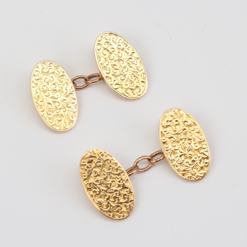 1120 - A pair of late 19th century 15ct gold cufflinks, oval panels with engraved foliate decoration, by BH... 