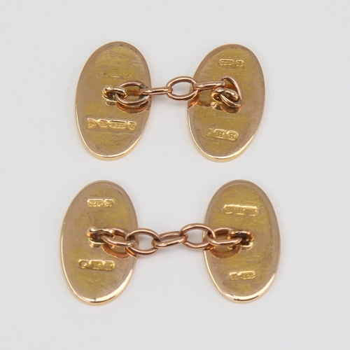 1120 - A pair of late 19th century 15ct gold cufflinks, oval panels with engraved foliate decoration, by BH... 