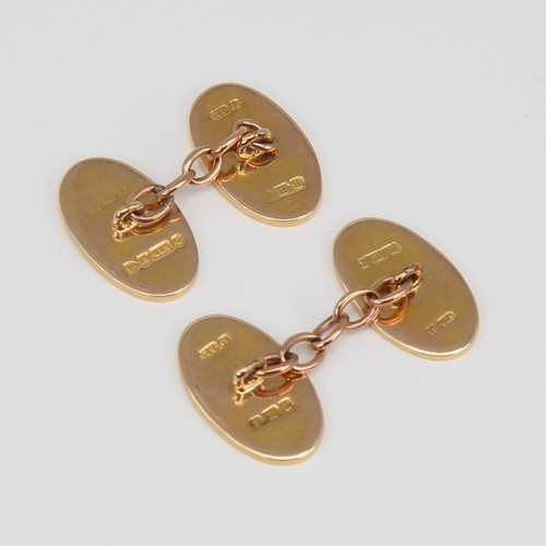 1120 - A pair of late 19th century 15ct gold cufflinks, oval panels with engraved foliate decoration, by BH... 