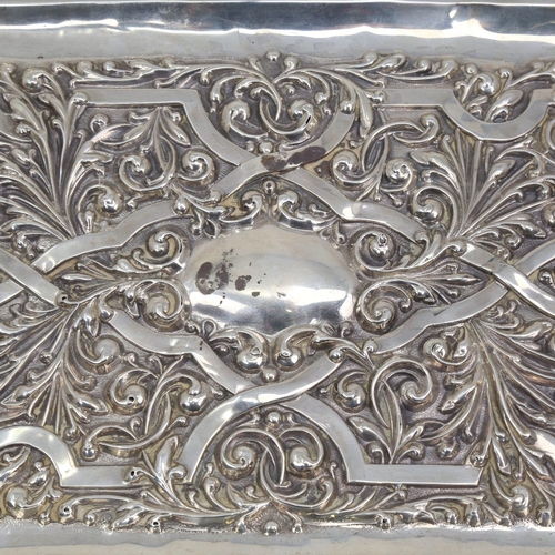 1122 - An Edwardian rectangular silver tray, allover relief embossed foliate decoration, by Williams Birmin... 